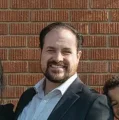 TYLER M.
